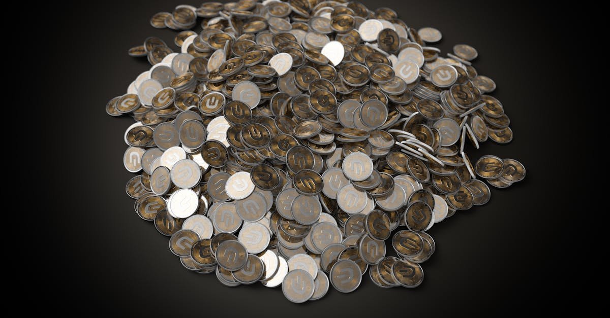 Coin dealer examining gold and silver coins for online sale